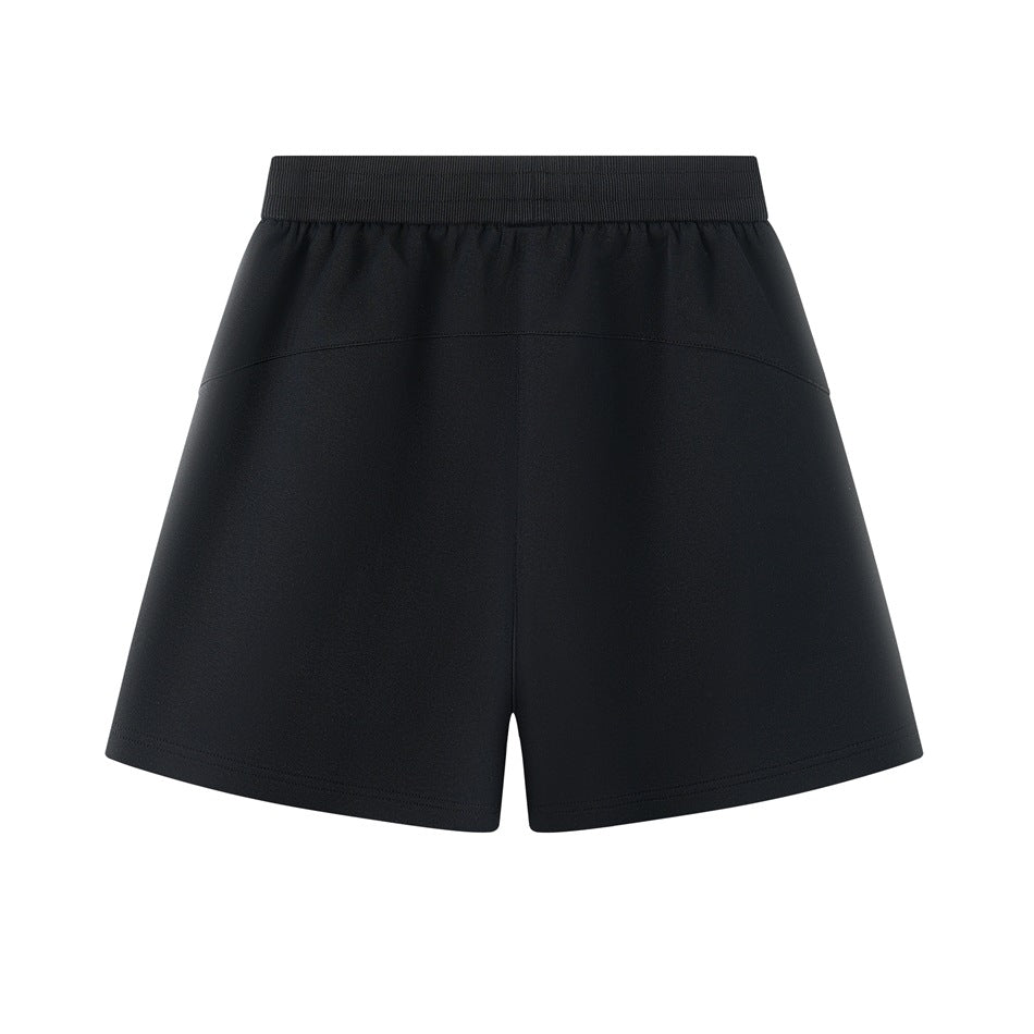 Back view of black shorts with a ribbed waistband and curved yoke seam.