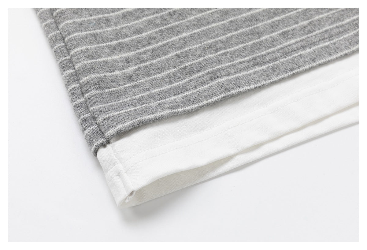 Close-up of the gray-and-white striped shirt's layered white hem.