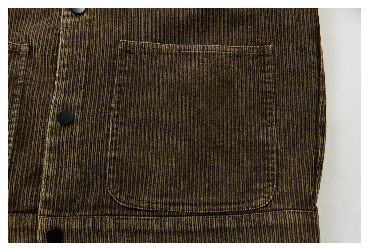 Close-up of a large patch pocket on a brown corduroy jacket.