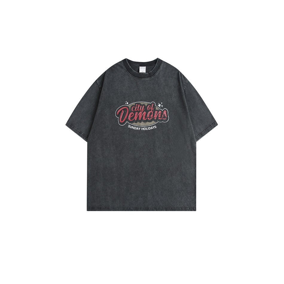 Faded black short-sleeve T-shirt with red 'city of Demons' chest graphic, flat lay front view