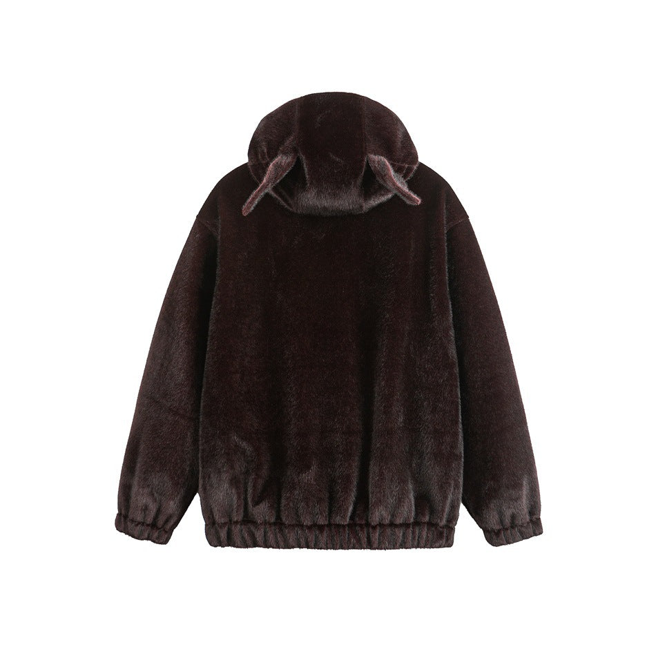 Back view of a dark burgundy-brown plush jacket with long sleeves, an elasticized hem and a hood with pointed flaps.