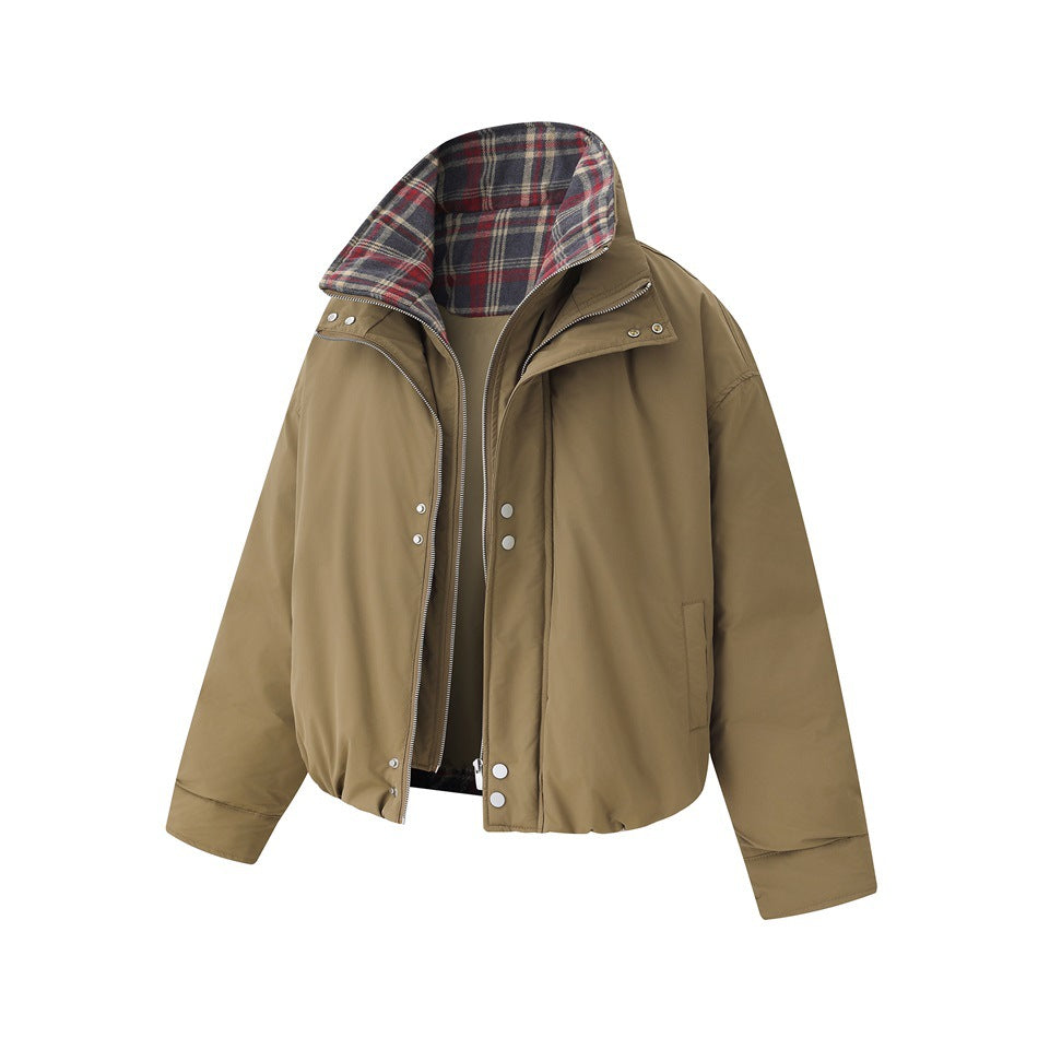Front view of a khaki jacket with a plaid-lined stand collar, front zipper, snap-button storm flap and long sleeves.