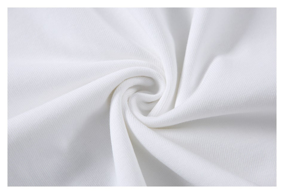 Close-up of white knit fabric gathered into a spiral fold.
