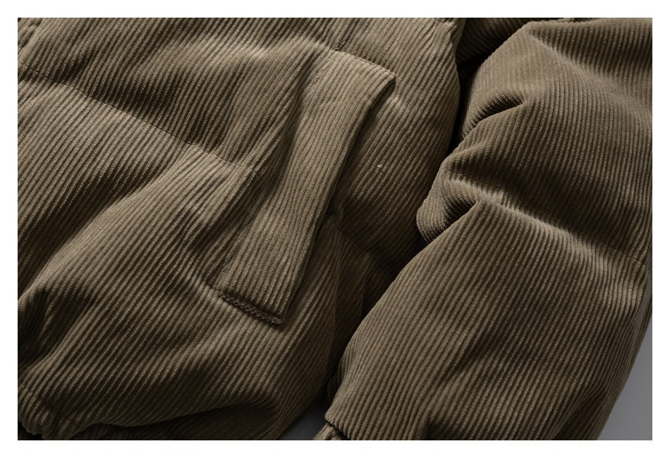 Close-up showing a front pocket and padded sleeve with ribbed texture.