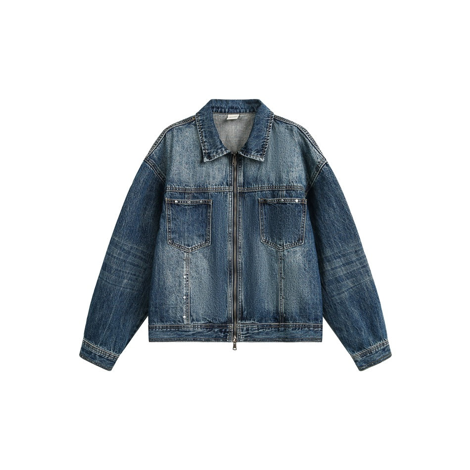 Blue washed denim jacket flat lay, front view with zip closure, chest pockets and faded sleeves