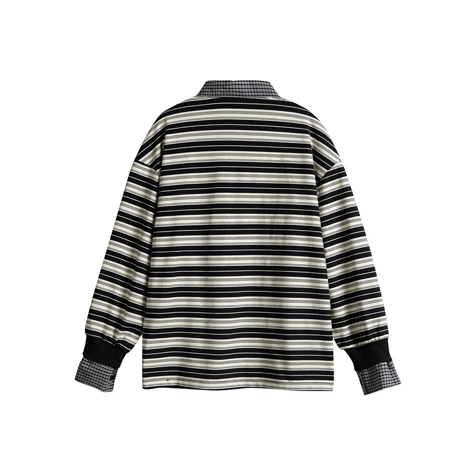Back view of black and cream striped long-sleeve polo with plaid collar edge and plaid cuffs