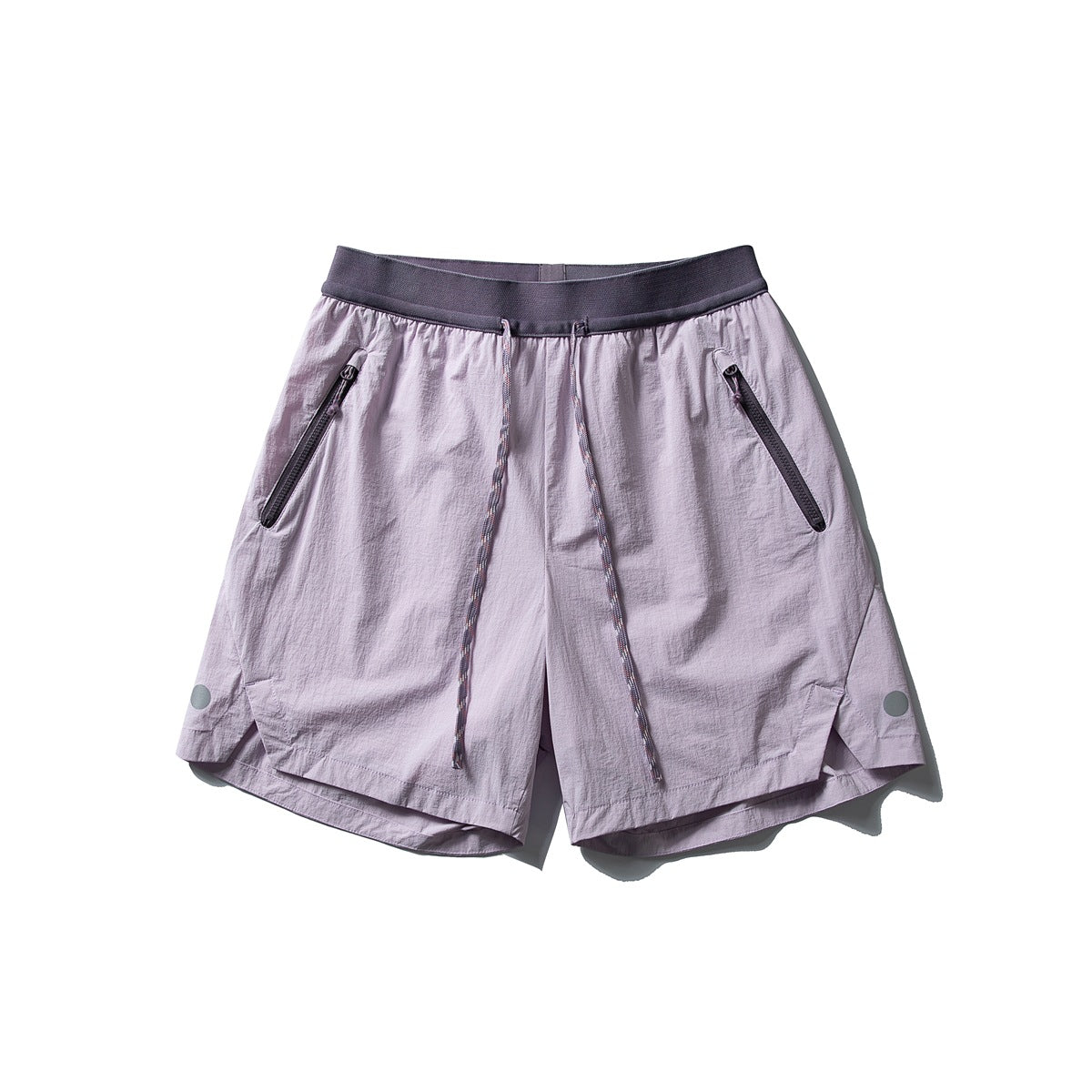 Pink purple drawstring shorts with dark gray waistband, zippered front pockets and curved side-vent hem, flat lay
