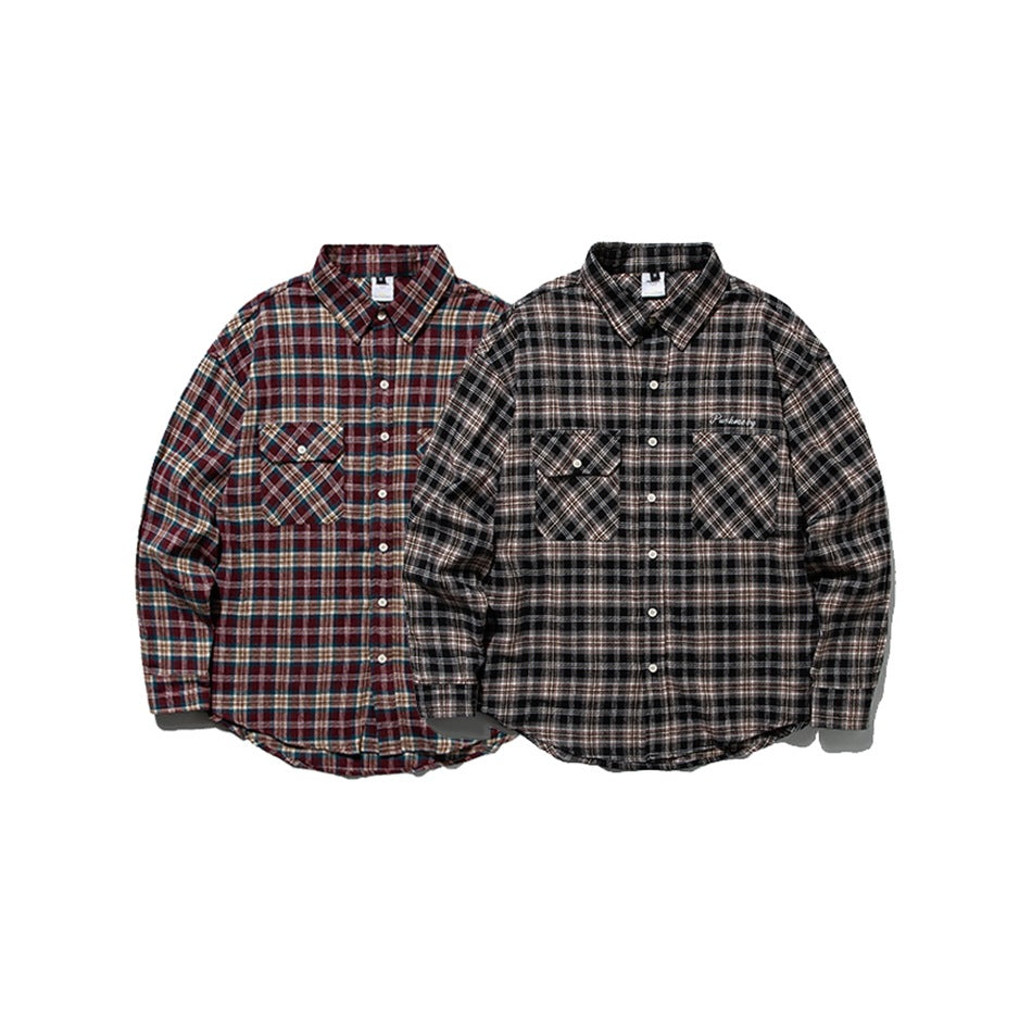 Two long-sleeve plaid button-up shirts shown from the front: one burgundy and teal, one black and gray.