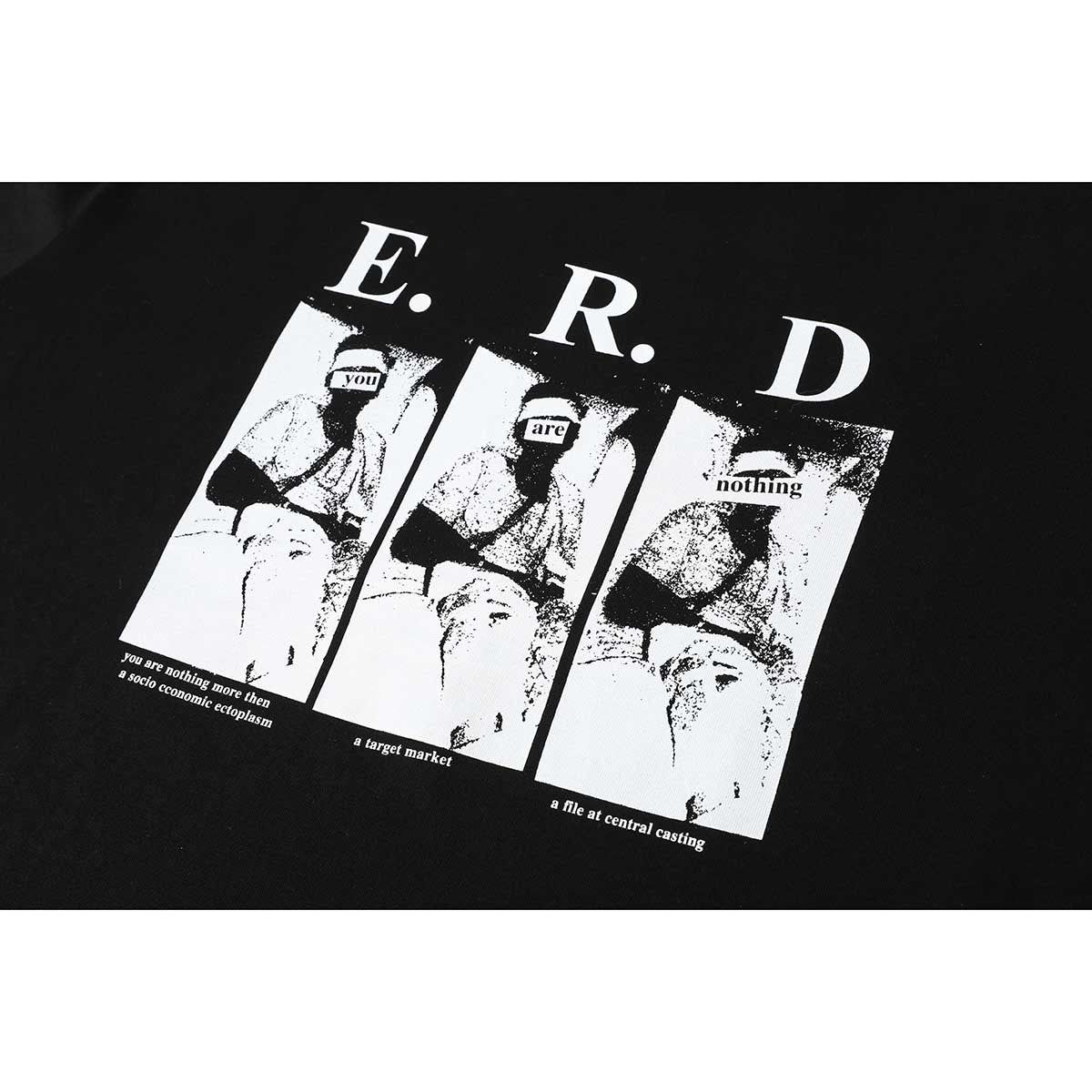 Close-up of a black T-shirt's white E.R.D. graphic, with three monochrome panels and English text.
