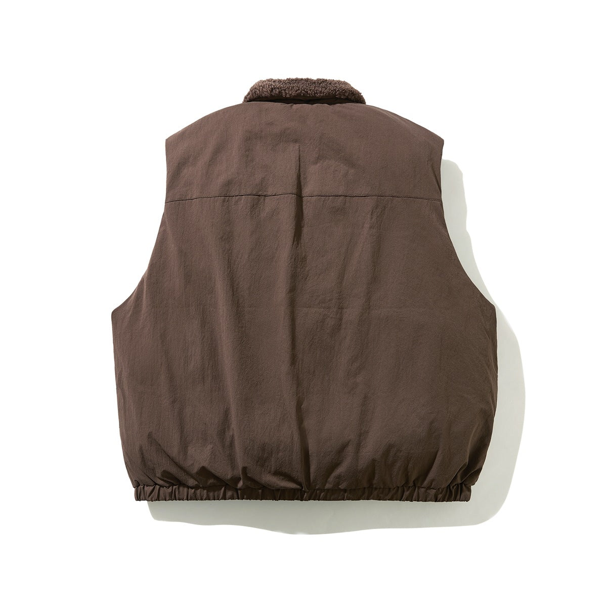 Back view of a dark brown sleeveless vest with a fleece collar and elastic hem.