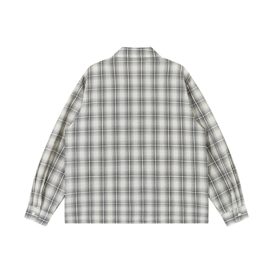 Back view of a light plaid long-sleeve shirt with button cuffs.