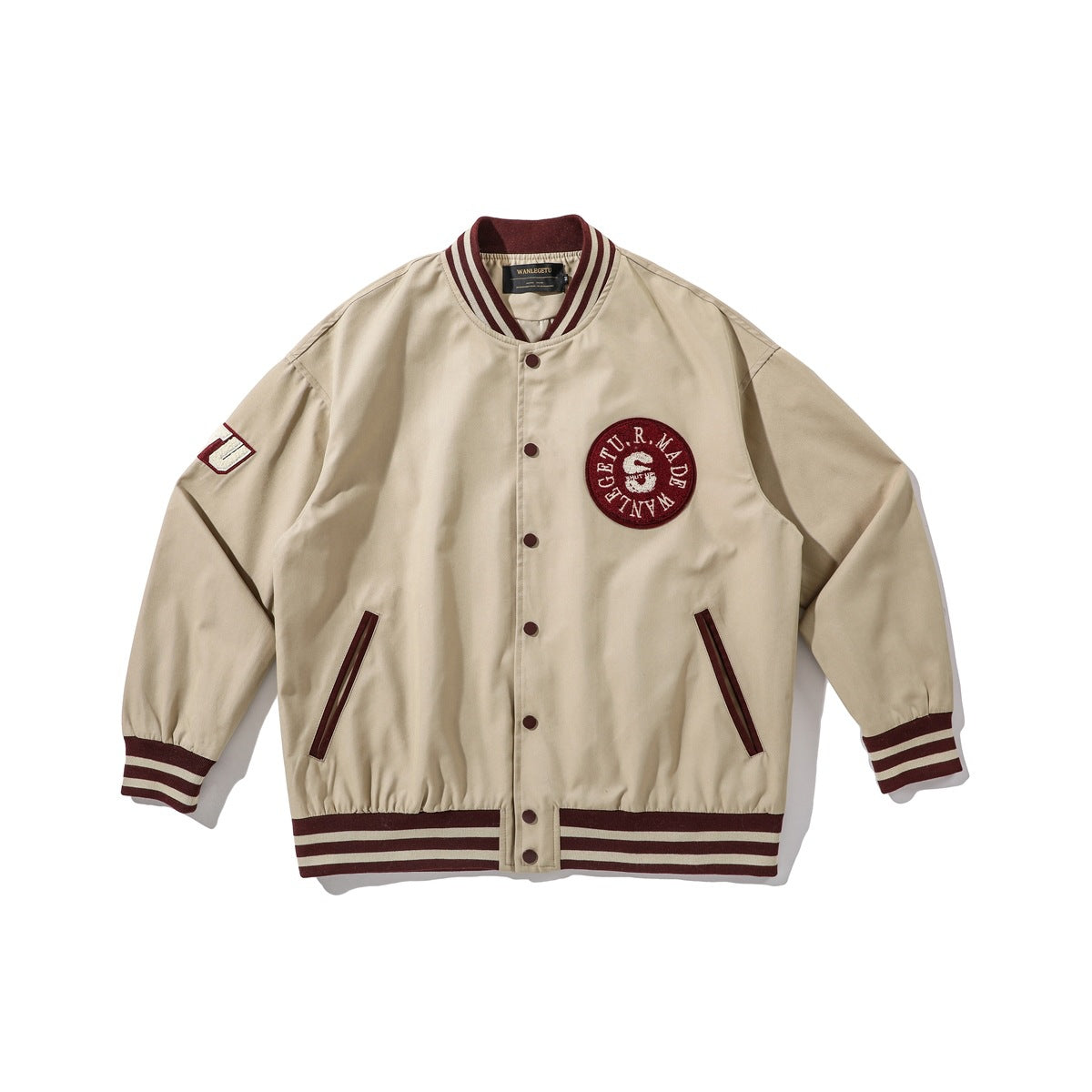 Khaki varsity jacket with burgundy and cream striped collar, cuffs and hem, snap front and round chest patch
