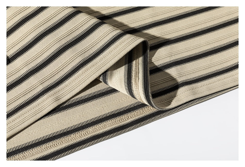 Close-up of the striped shirt's inside seam and overlocked stitching.