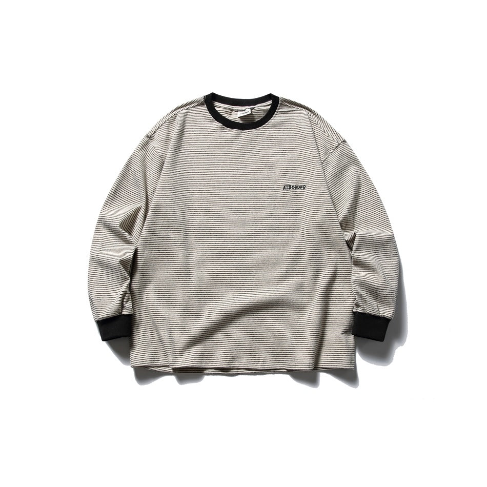 Khaki striped long-sleeve crew-neck top with black ribbed collar and cuffs, flat lay front view