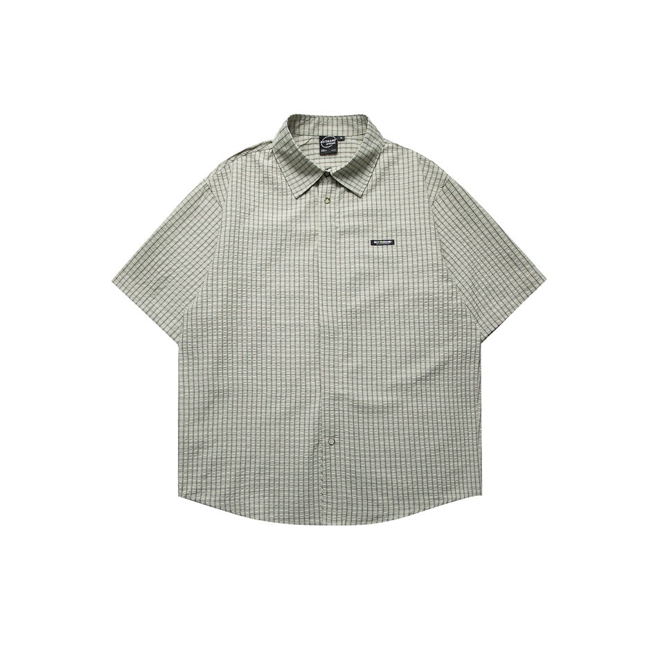 Light green checked short-sleeve button-front shirt with collar and chest label, flat front view