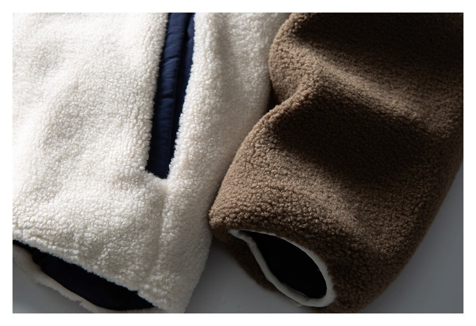 Close-up of white and brown fleece panels with navy trim and contrasting edges.