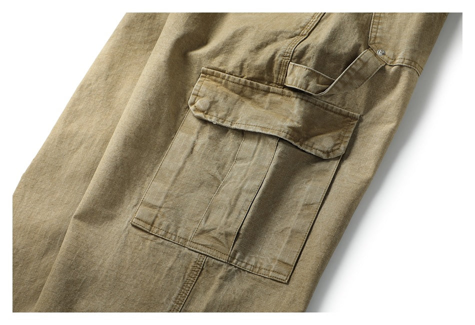 Close-up of a tan garment's flap cargo pocket and stitched panel.