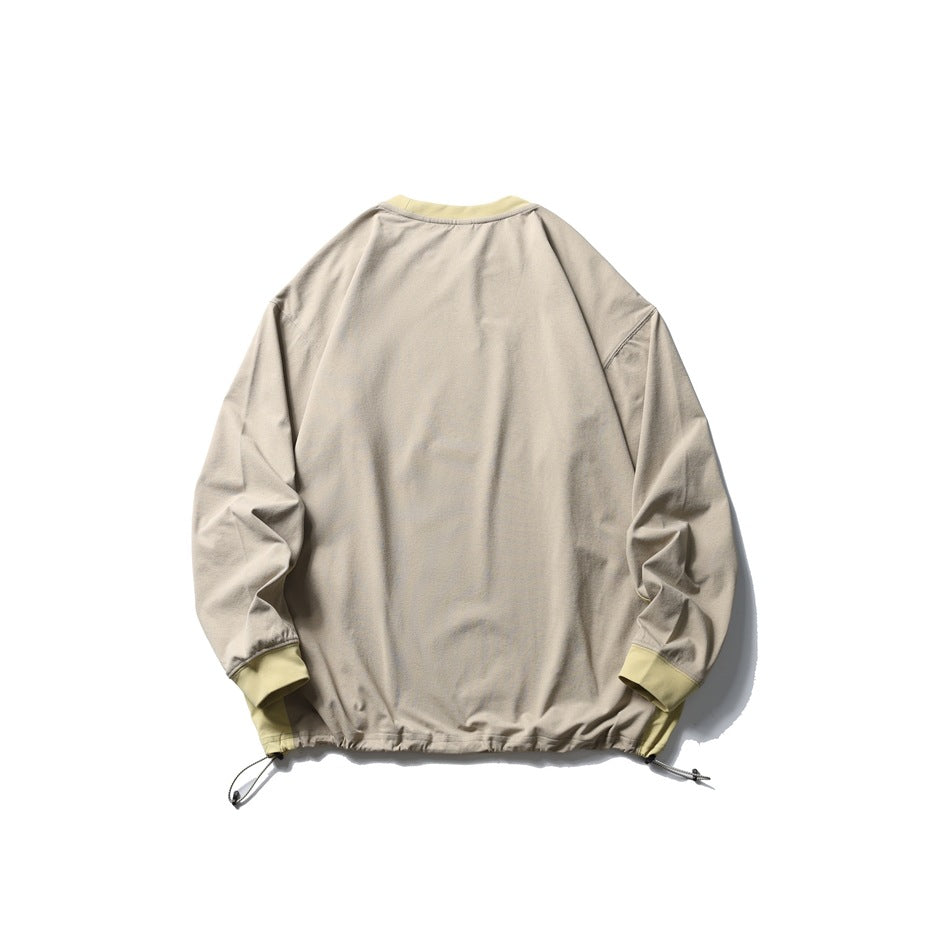 Back view of a light taupe long-sleeve pullover with pale yellow collar and cuffs and hem drawcords.