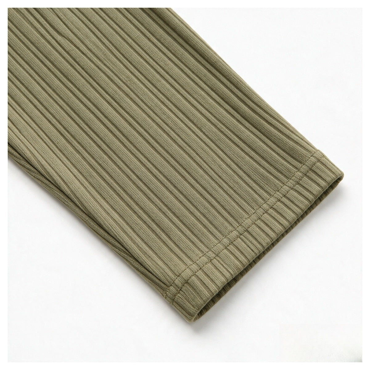 Close-up of an olive-khaki ribbed sleeve ending in a double-stitched cuff.