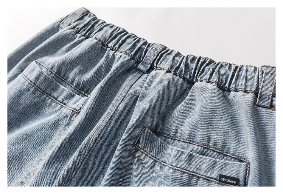 Close-up of the elastic back waistband and a rear pocket with a small DEVILRAY label.