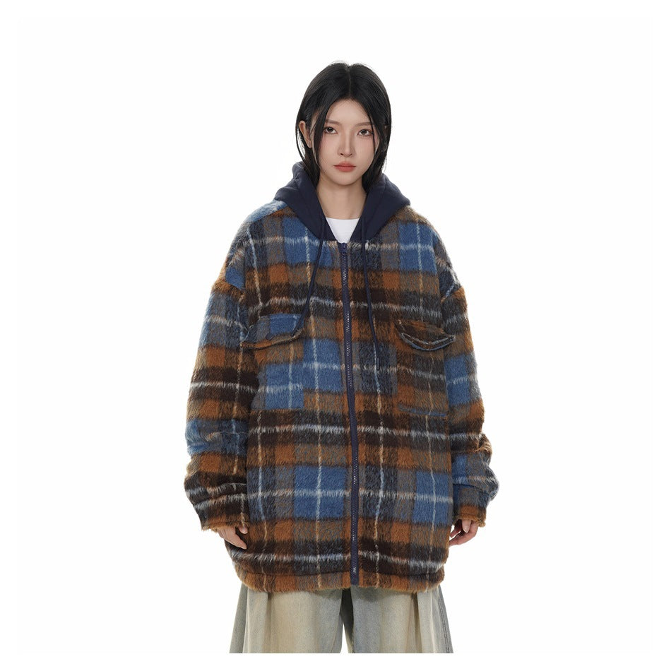 Model wearing a blue and brown plaid hooded zip jacket with flap chest pockets and light-wash trousers.