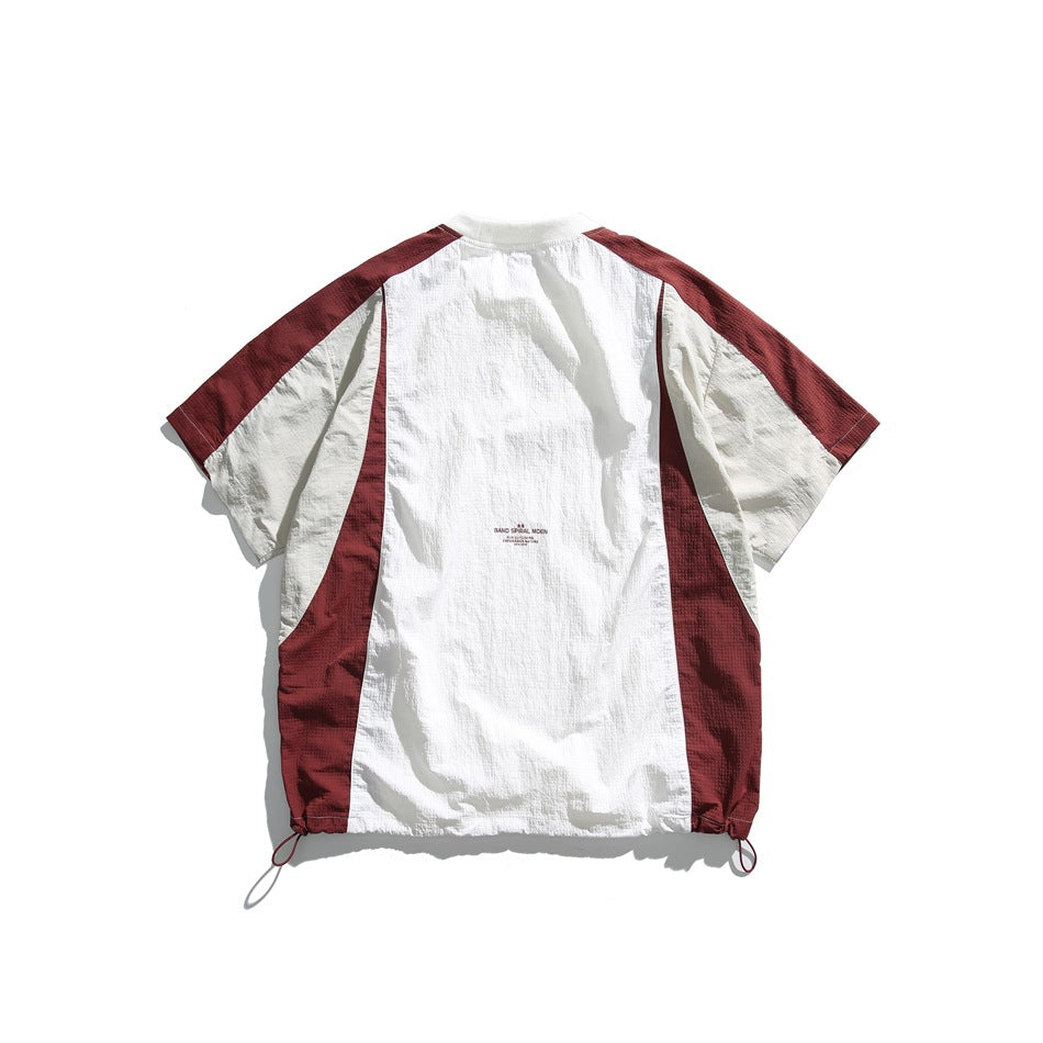 Back view of a white and burgundy color-block short-sleeve shirt with a gathered drawcord hem.