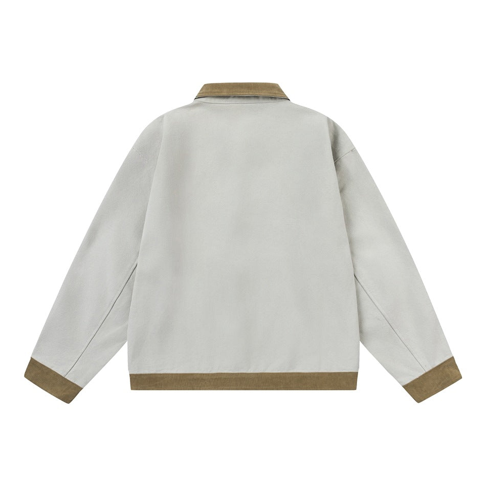 Back view of a pale gray jacket with a tan corduroy collar, cuffs and hem.