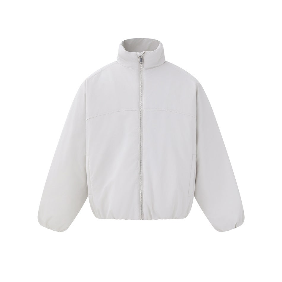Front view of a white jacket with a tall collar, full-length zipper, and long sleeves.