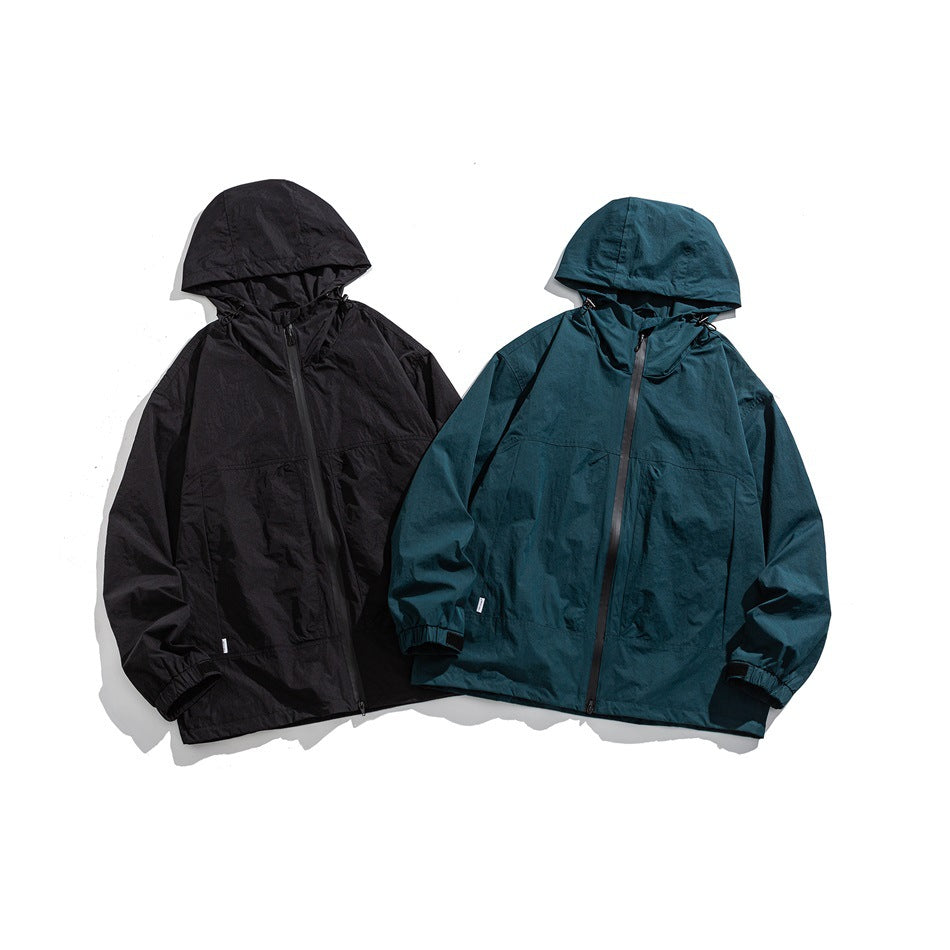 Front flat lay of two hooded zip jackets, one black and one deep teal.