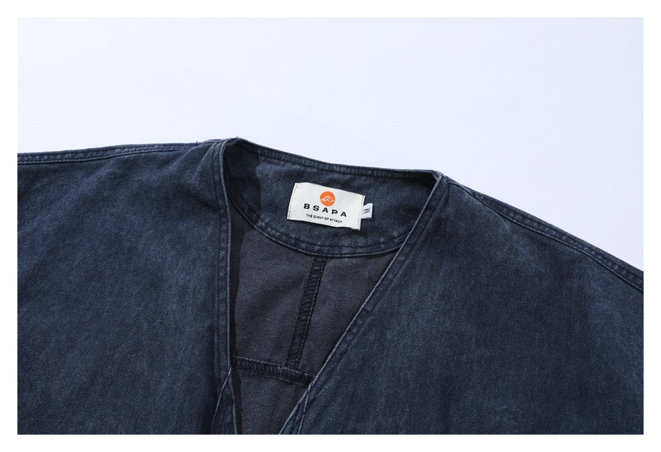 Close-up of the dark indigo jacket neckline and its sewn-in brand label.