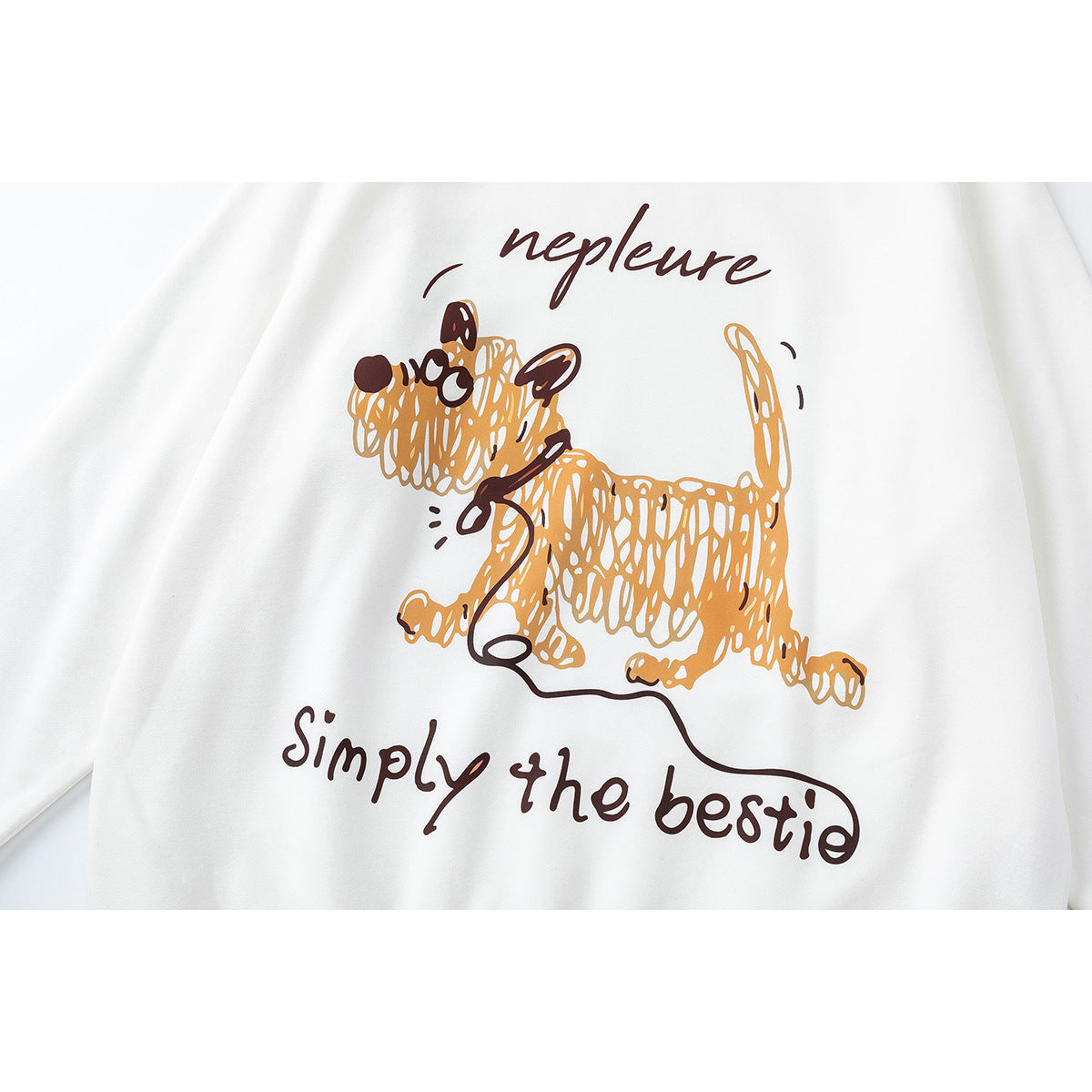 Close-up of a tan cartoon dog and brown English lettering printed on white fabric.