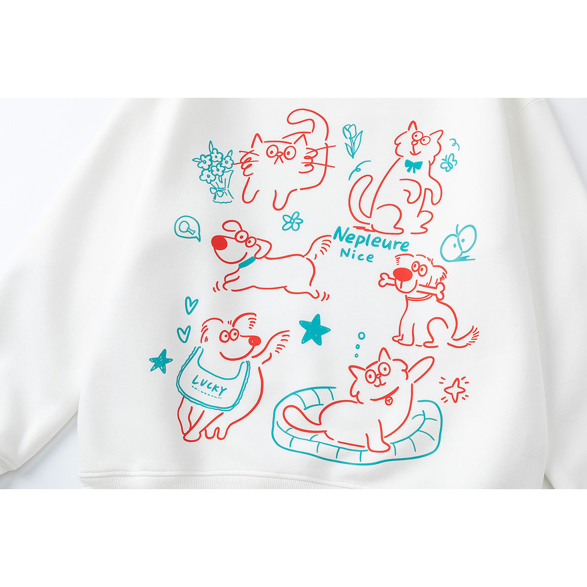 White sweatshirt close-up with red and teal cartoon cats and dogs and English lettering.