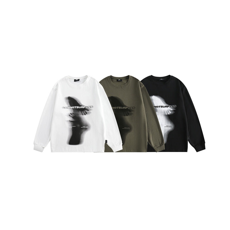 Three long-sleeve graphic shirts shown together in white, olive, and black.