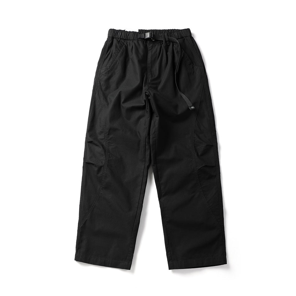 Flat-lay front of black wide straight-leg pants with elastic waist, black buckle belt and curved leg seams