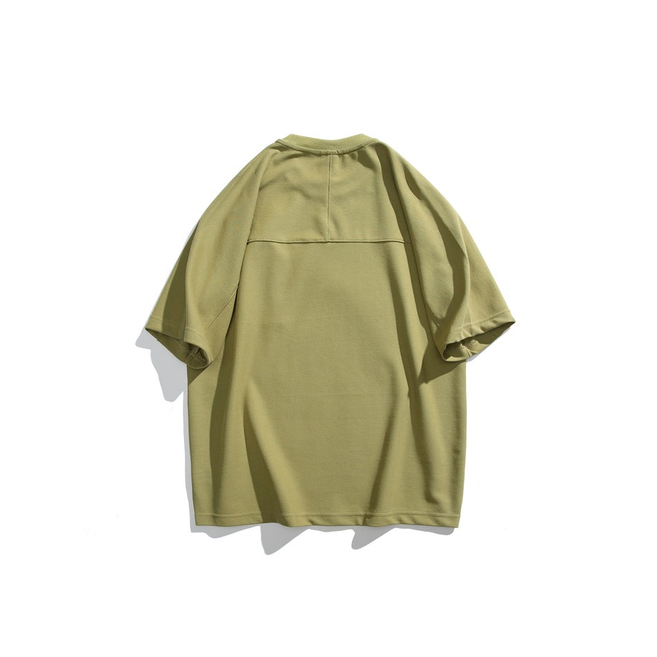 Back view of a muted olive short-sleeve T-shirt laid flat against a white background.