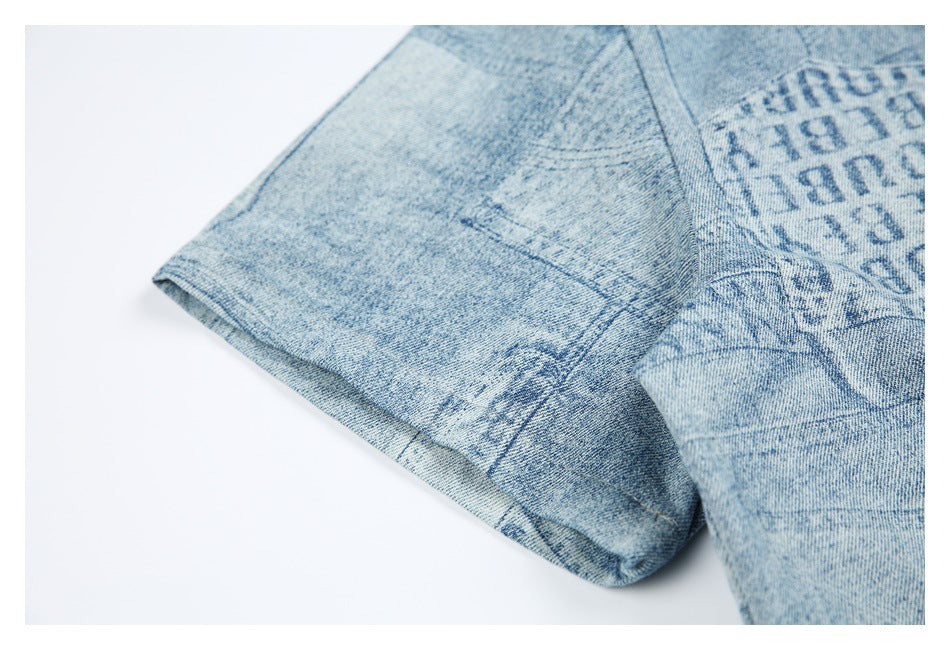 Close-up of the short sleeve and stitched cuff on the light blue patchwork-print shirt.