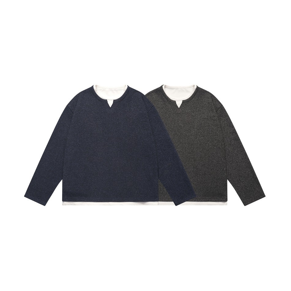 Two long-sleeve tops shown from the front: navy and charcoal marled, each with a white layered crew neck and hem.