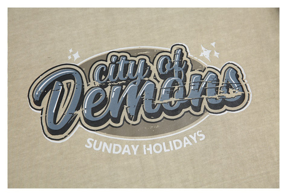 Close-up of the T-shirt's distressed black, gray, and white graphic reading “City of Demons” and “Sunday Holidays.”