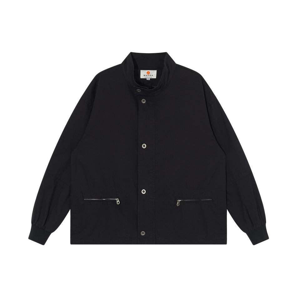 Black stand-collar jacket with button front, two zippered pockets and ribbed cuffs, flat lay front view