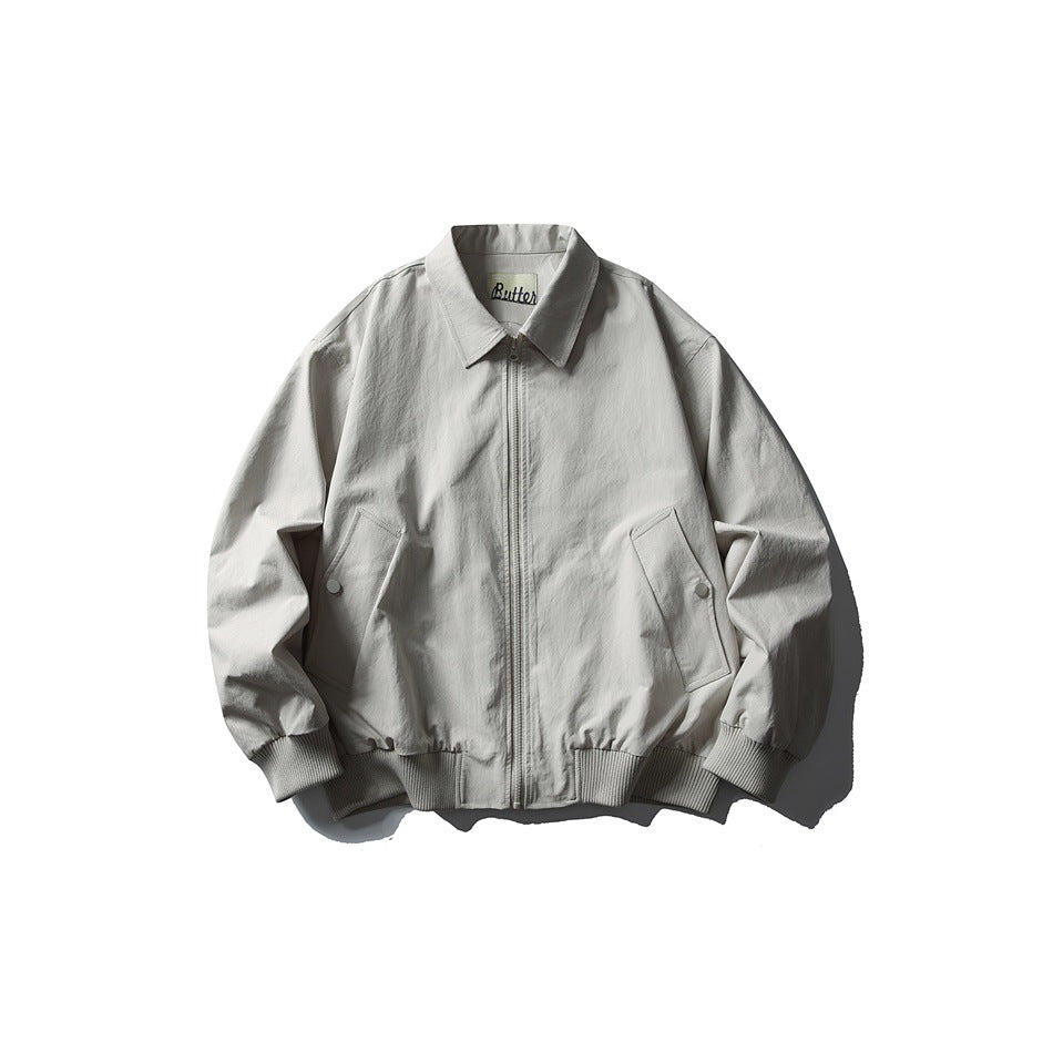 Grayish white zip-front jacket with turn-down collar, slanted pockets and ribbed cuffs and hem, flat lay front view
