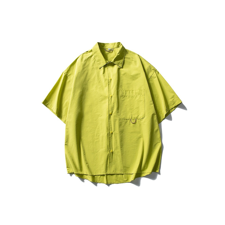 Fluorescent yellow-green short-sleeve button-front shirt with chest pocket, flat lay on white background