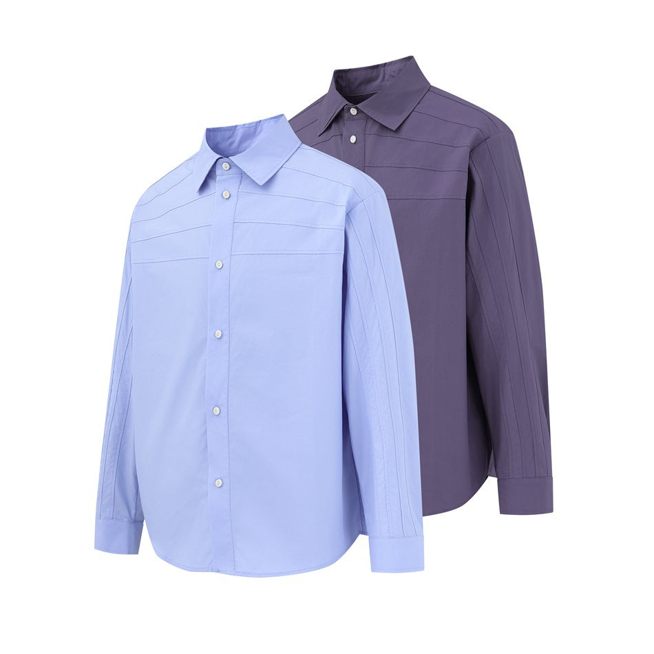 Two long-sleeve button-up shirts with horizontal stitched panels, shown in light blue and dark purple.