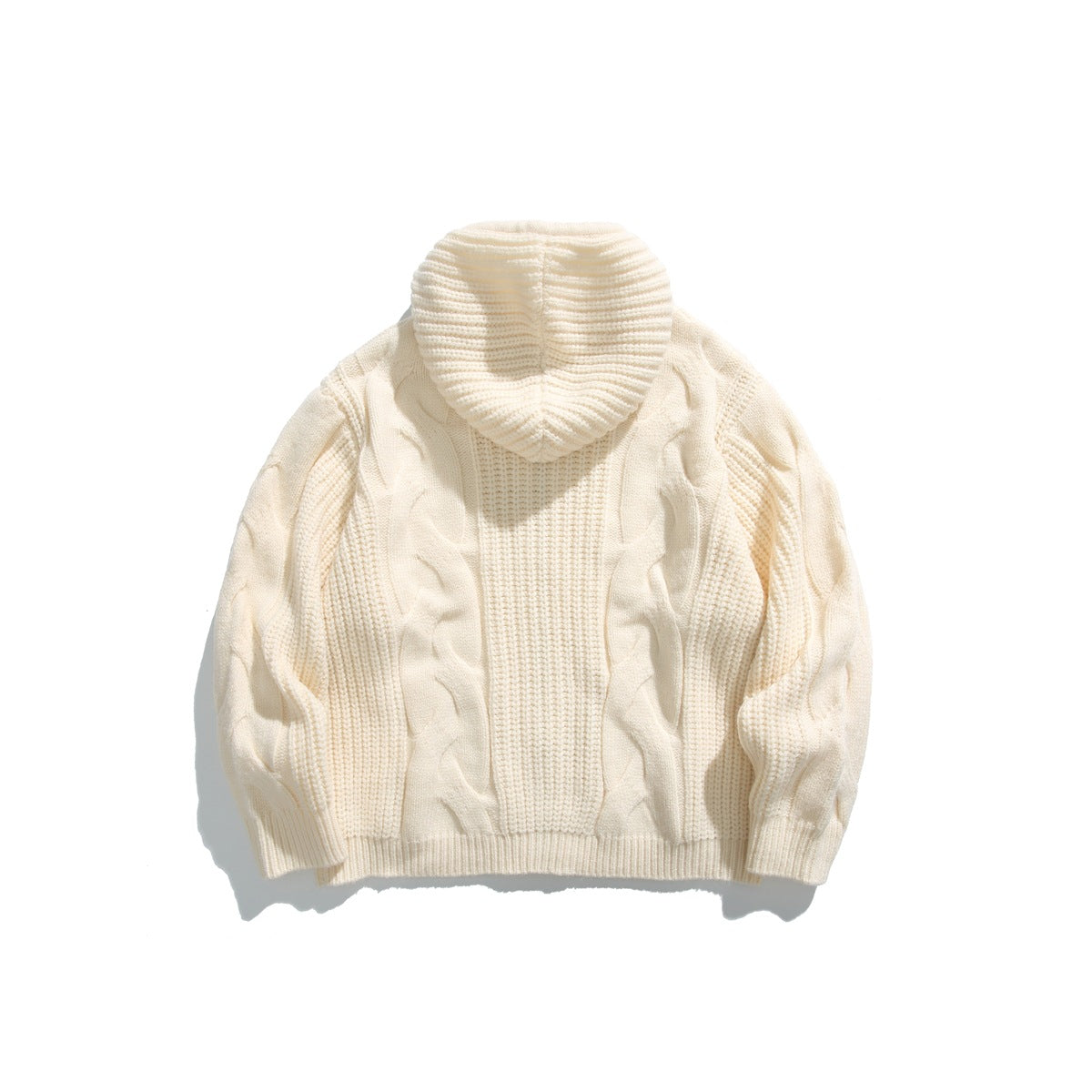 Cream cable-knit hooded sweater laid flat, showing the back, ribbed hood, sleeves, and hem.