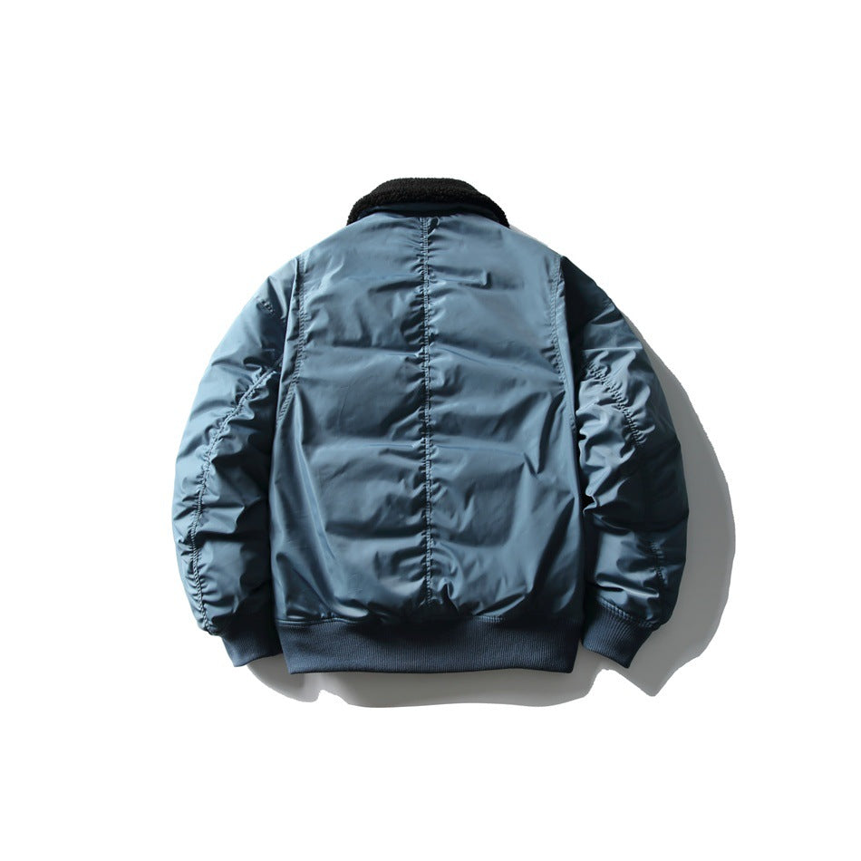 Back view of a blue jacket with a black fleece collar, center seam, and ribbed cuffs and hem.