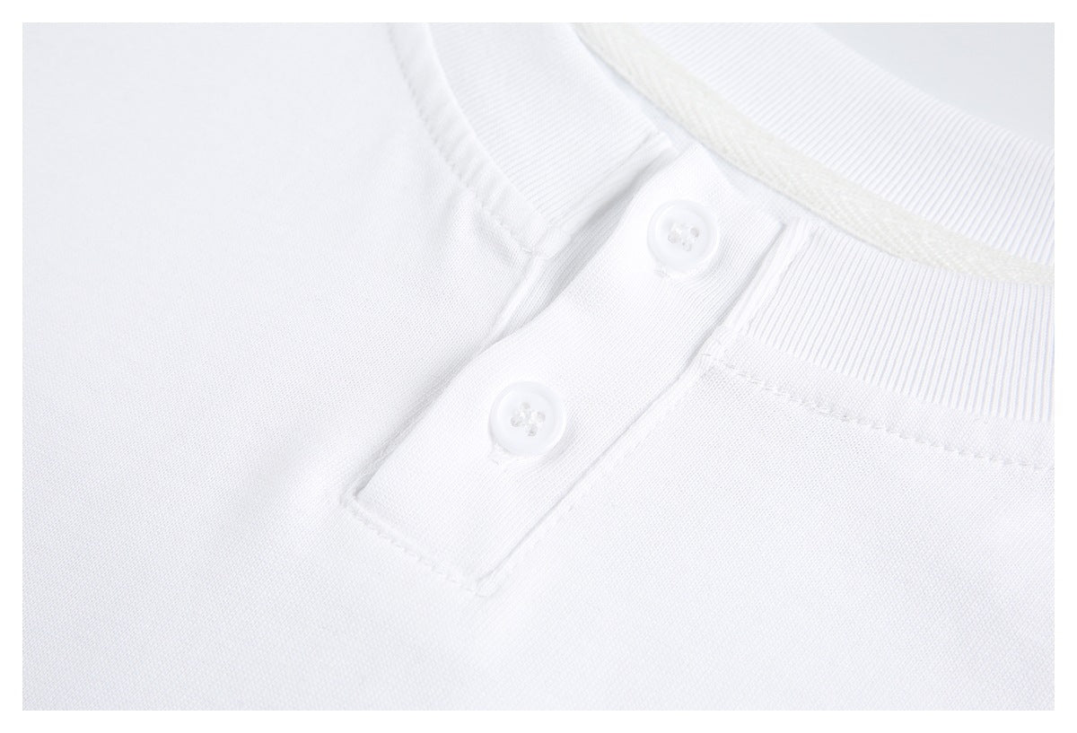 Angled close-up of a white shirt's ribbed neckline and two-button placket.