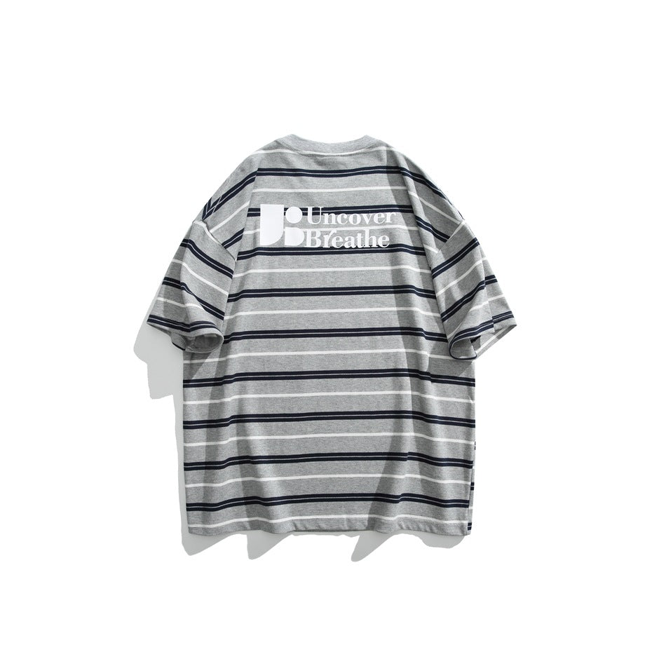 Back of gray T-shirt with navy and white stripes and a white Uncover Breathe print