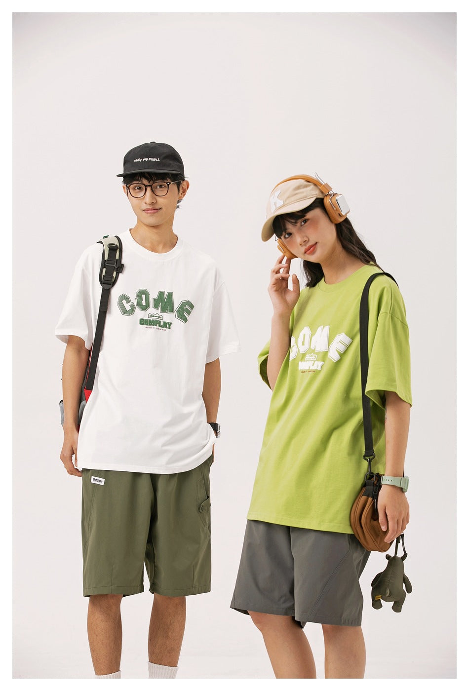 Two models wearing white and lime green graphic T-shirts with casual shorts and accessories.