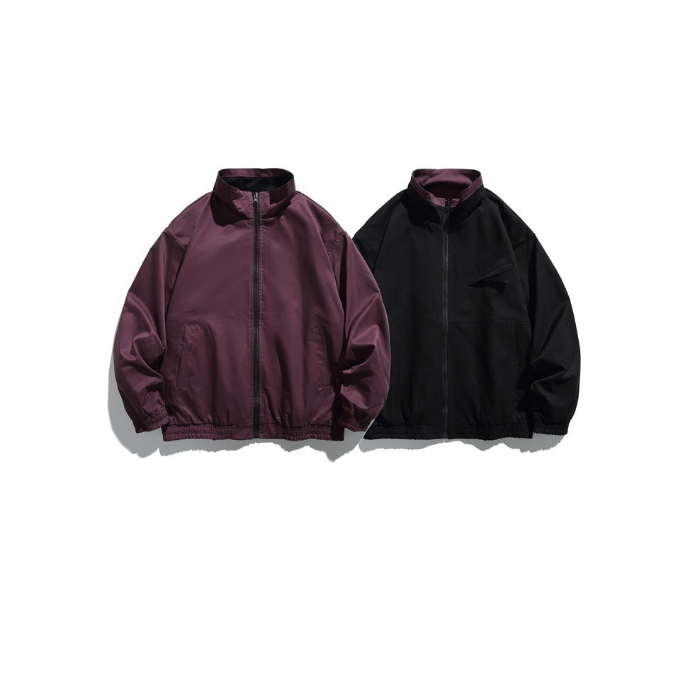 Burgundy zip jacket beside a black zip jacket with a purple collar, both flat on a white background