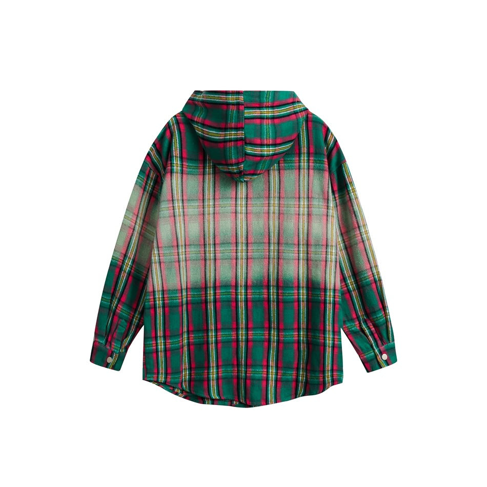 Back view of a green and red plaid hooded shirt with long sleeves and a curved hem, laid flat on white.