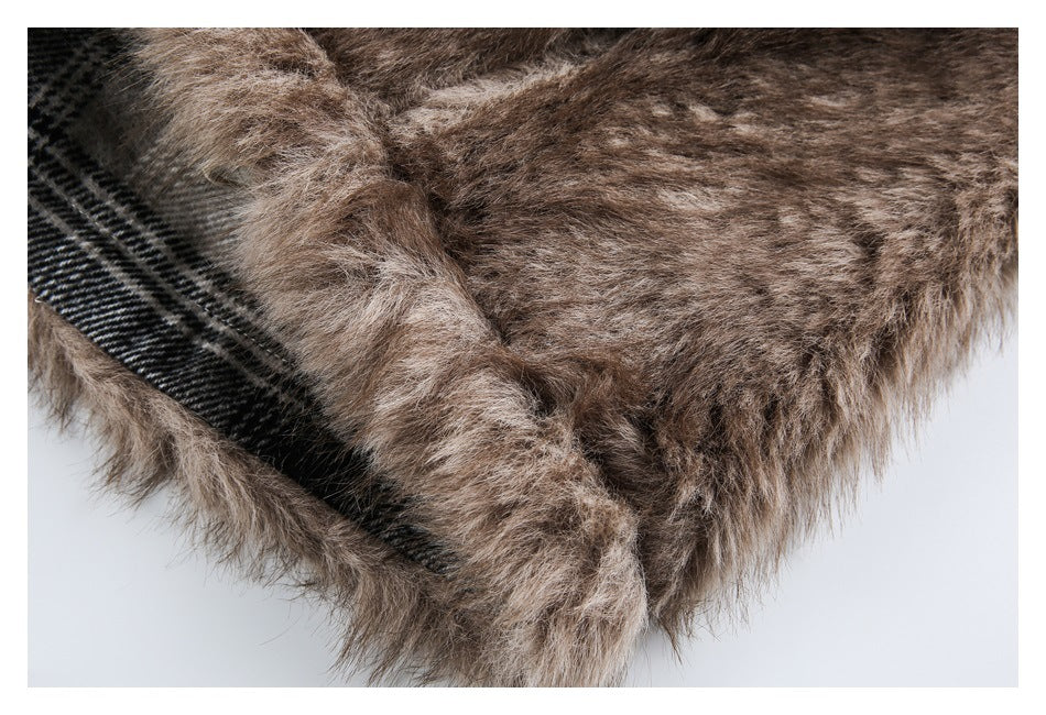 Close-up of brown faux fur with black-and-gray plaid lining visible along the garment edge.